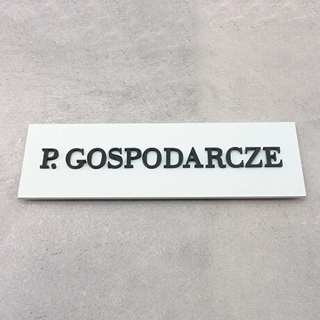 Tabliczka pomieszczenie gospodarcze z czarnymi matowymi napisami